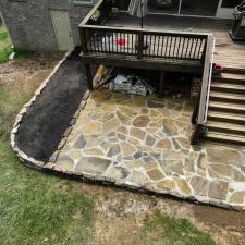 Natural stone retaining wall and Flagstone patio